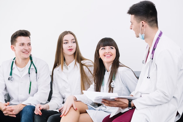 Cheerful young medics sitting together