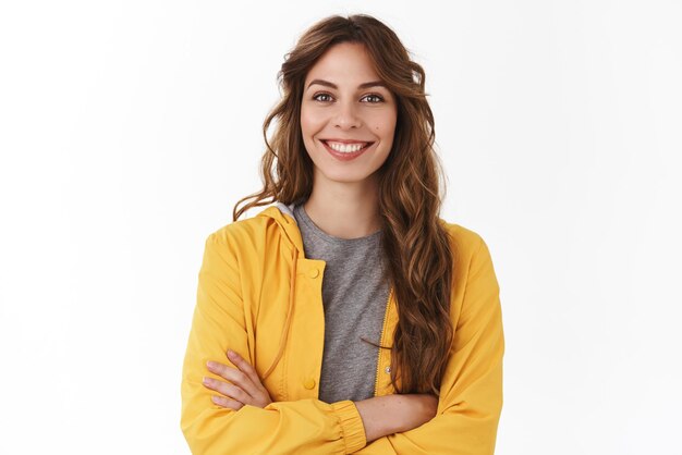 Cheerful young new attractive female employee ready help energized look upbeat confident camera cross arms chest selfassured smiling toothy aim bright successful future standing white background