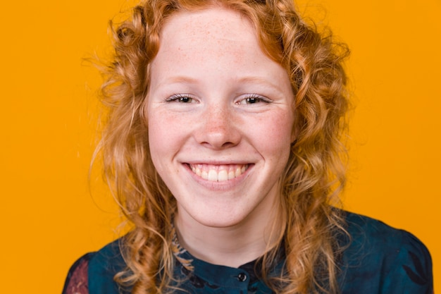 Cheerful young redhead woman smiling