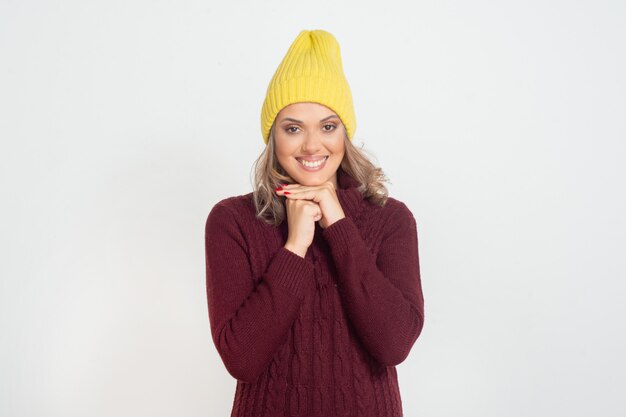 Cheerful young woman in yellow hat