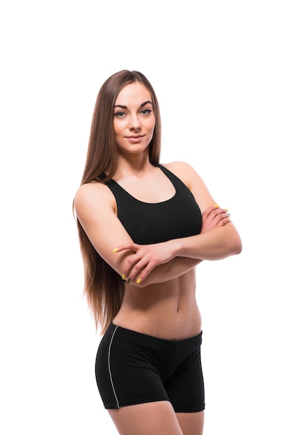 Cheerfully smiling mixed race sporty woman looking at camera, isolated on white background