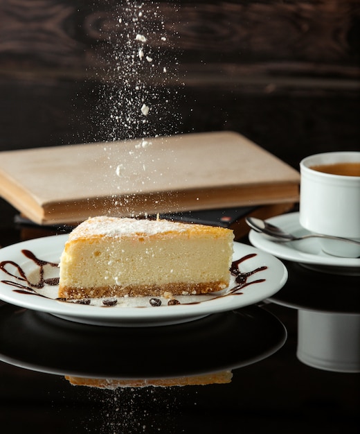 Cheese cake with tea on the table