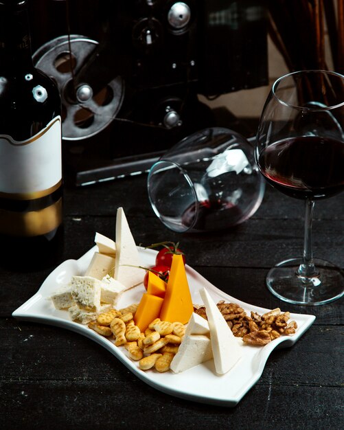 Cheese plate with crackers and walnuts