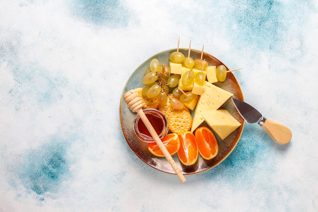 Cheese plate with delicious tilsiter cheese and snacks.