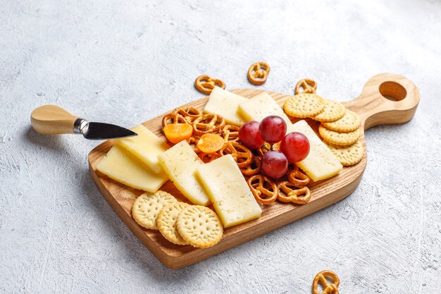 Cheese plate with delicious tilsiter cheese and snacks.