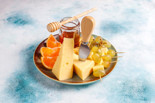 Cheese plate with delicious tilsiter cheese and snacks.