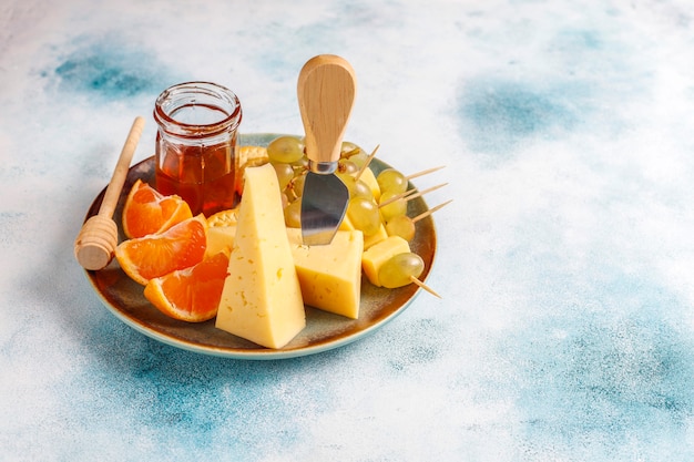 Cheese plate with delicious tilsiter cheese and snacks