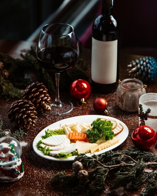 Cheese plate with glass of red wine _