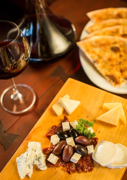 Cheese plate with a glass of red wine