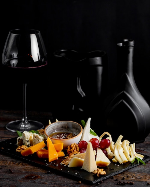 Cheese plate with glass of wine