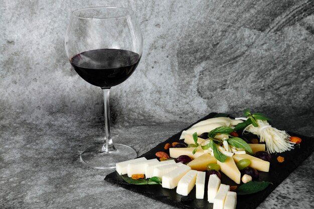 Cheese plate with glass of wine