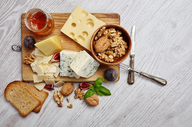 Free photo cheese plate with vegetables and supplies top view