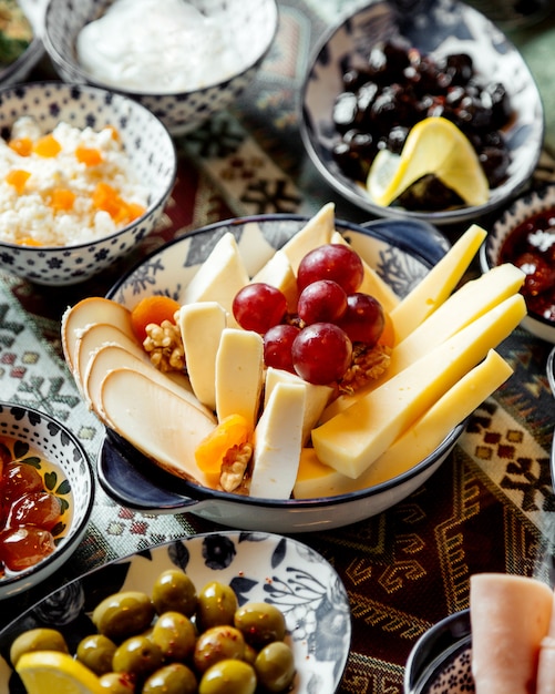 Cheese plate with winegrapes on top