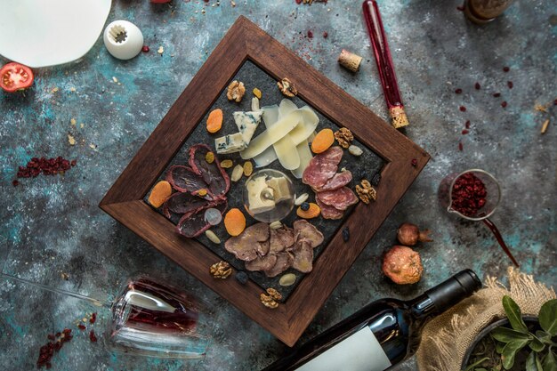 Cheese platter with snacks, top view