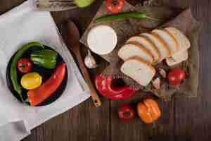 Free photo cheese, vegetabels and bread. top view