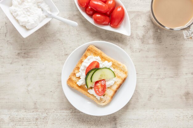 Cheese and vegetables toast and coffee