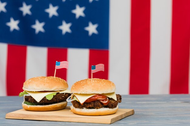 Cheeseburgers on wooden board