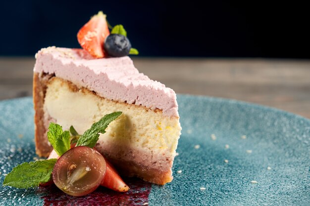 Cheesecake with berries on decorated plate