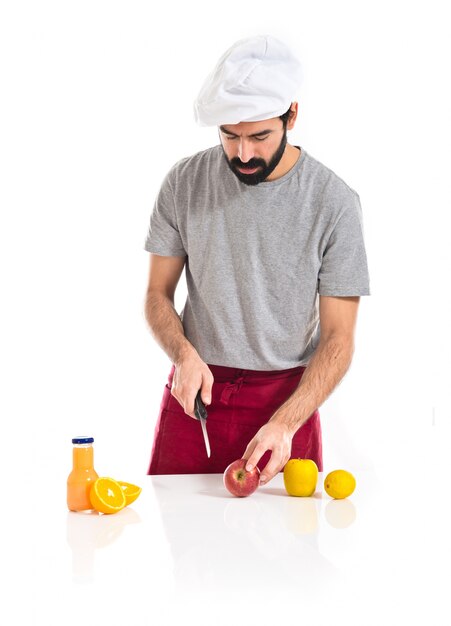 Chef cutting an apple