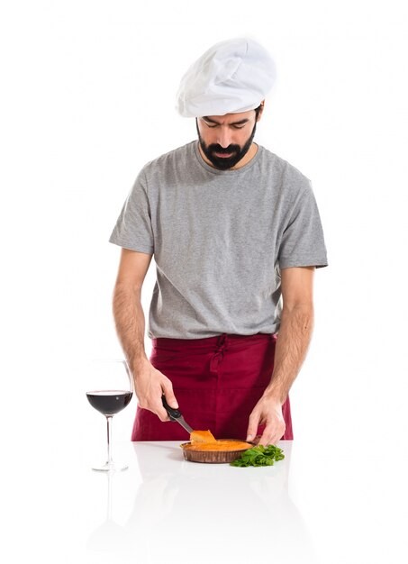 Chef cutting a cake