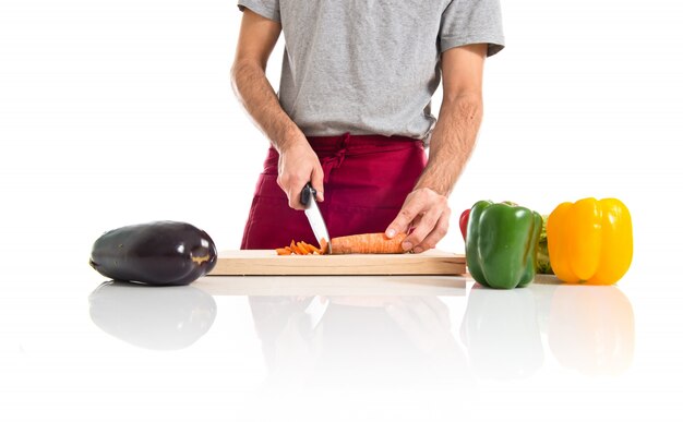 Chef cutting a carrot