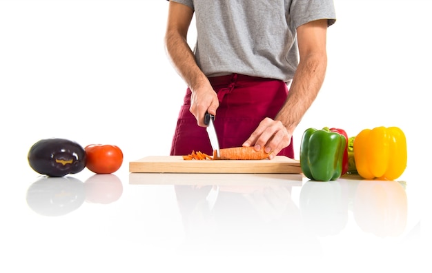 Chef cutting a carrot