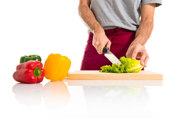 Chef cutting lettuce