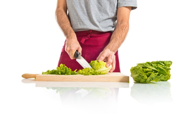 Chef cutting lettuce