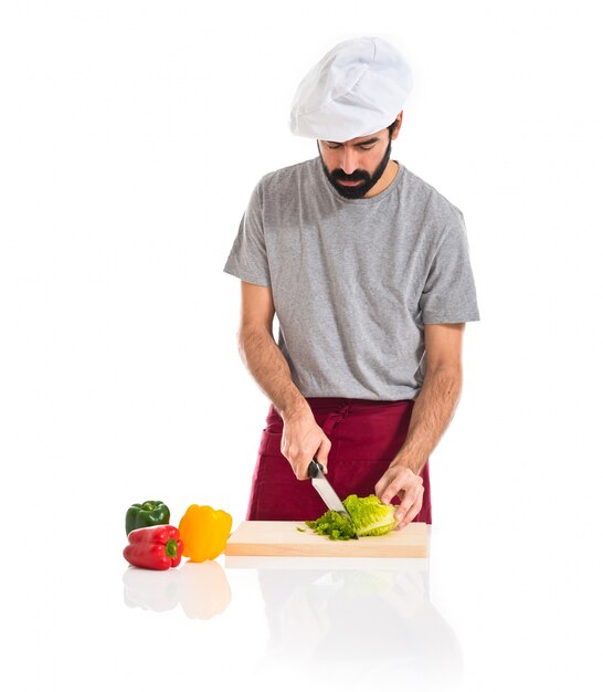 Chef cutting lettuce