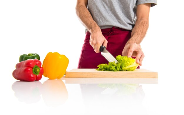 Chef cutting lettuce