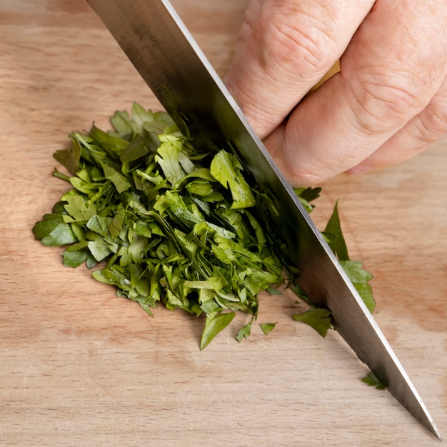 Chef cutting parsley