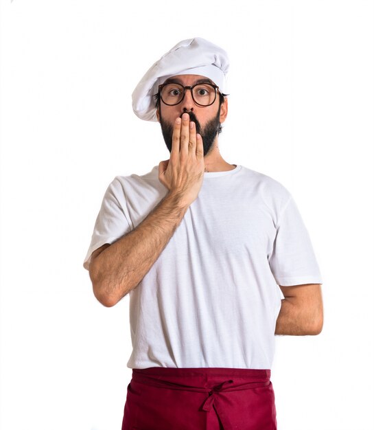 Chef doing surprise gesture over white background