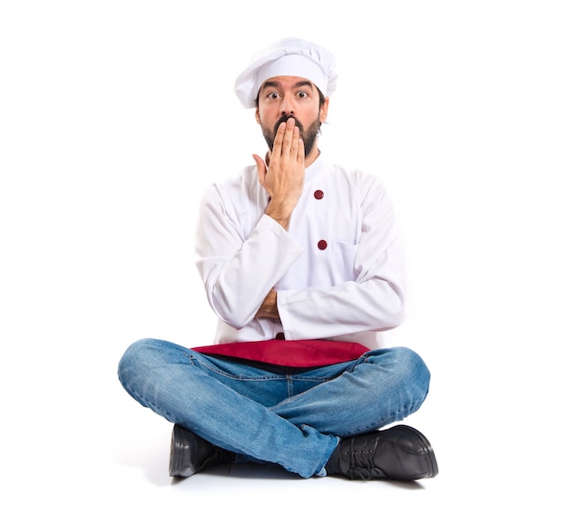 Chef doing surprise gesture over white background