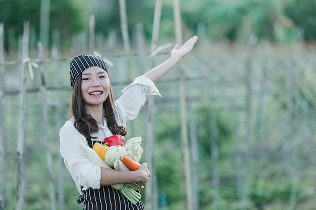 Chef harvesting fresh produce off organic farm