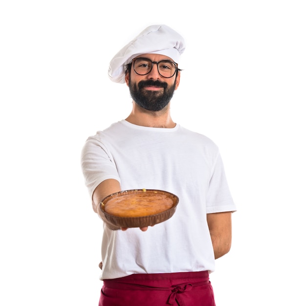 Chef holding cake