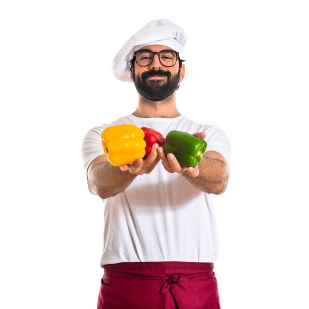 Chef holding colorful peppers