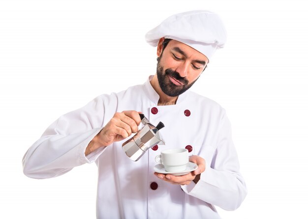 Chef holding a cup of coffee over white background