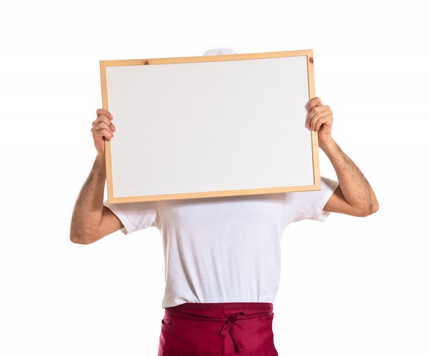 Free photo chef holding empty placard