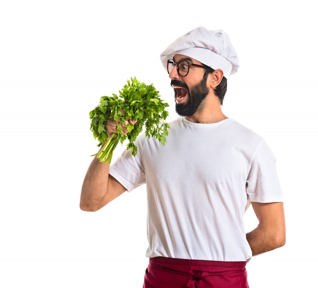 Chef holding lettuce over white background