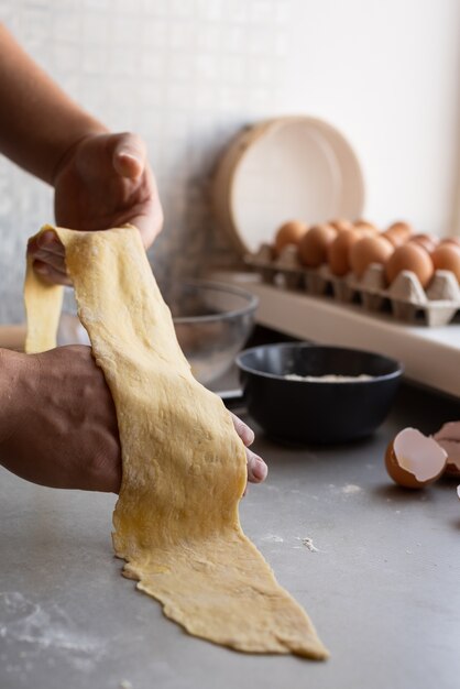 Chef holding pasta dough