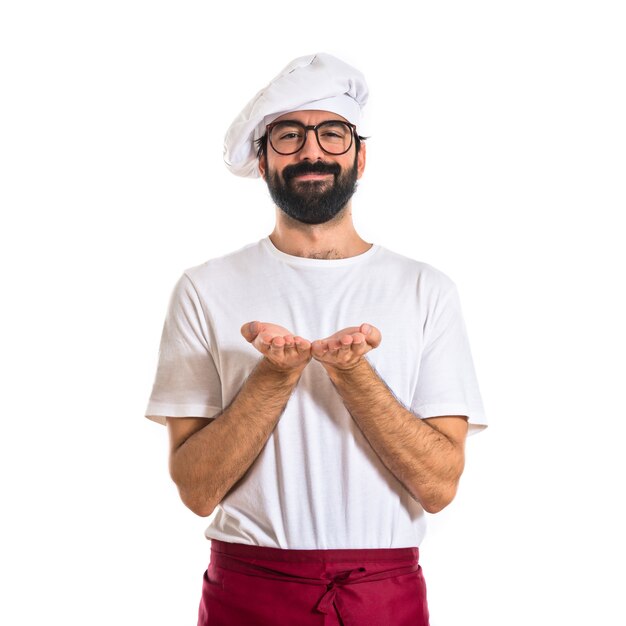 Chef holding something over white background