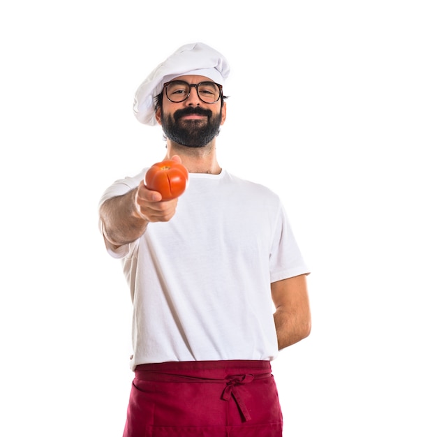 Chef holding tomato