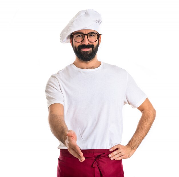 Chef making a deal over white background