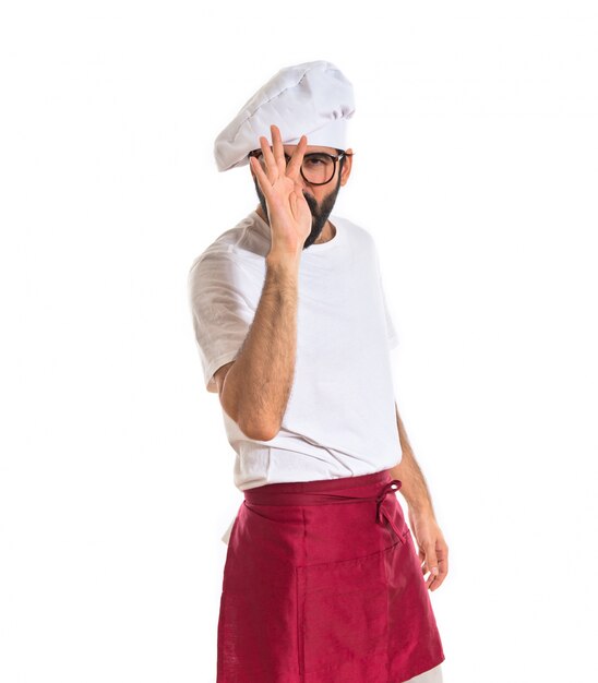 Chef making a joke over white background