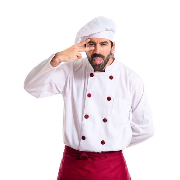 Foto gratuita chef facendo uno scherzo su sfondo bianco