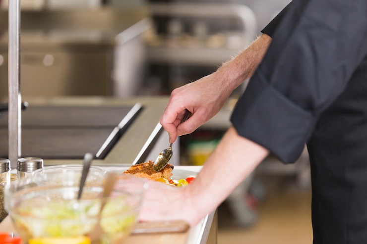 Free Photo chef preparing a dish of healthy food