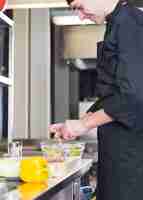 Free photo chef preparing a salad