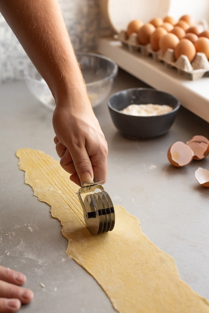 Chef shaping pasta dough