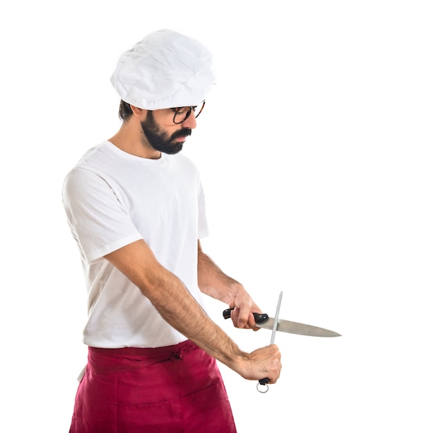 chef sharpening a knife
