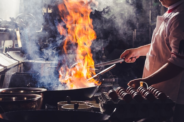 Professional chef and fire. Photo | Premium Download